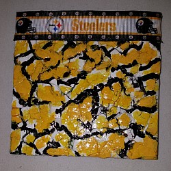 Ceramic tile coaster covered with eggshell pieces....NFL ribbon attached across the top