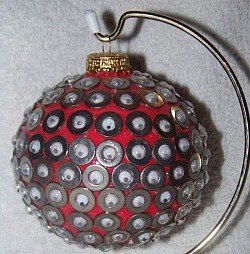 This ornament is covered with tiny stainless steel wasdhers and googly eyes.