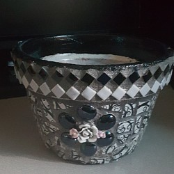 My very first mosaic flower pot which matches tables on my front porch.