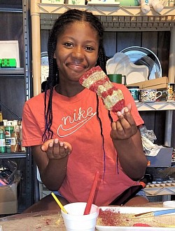 Jocelyn Brown creating a glitter fish for the fishing game.